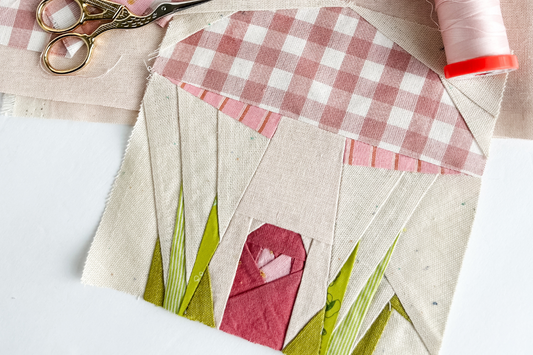 Foundation Paper Piecing FPP Mushroom Quilt Block made by Tamara Darragh of Remi Vail Studio. Designed by Happy Sew Lucky for the Back to Nature Quilt Along. Fabric used are pinks and greens.