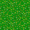 Pattern of colorful butterflies on a green background