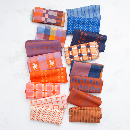 Collection of patterned fabric swatches in various colors on a white background