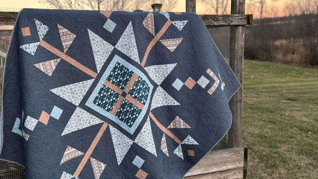 A Folk Inspired Snowflake Lumi Quilt Made With the Winter Magic Fabric Collection