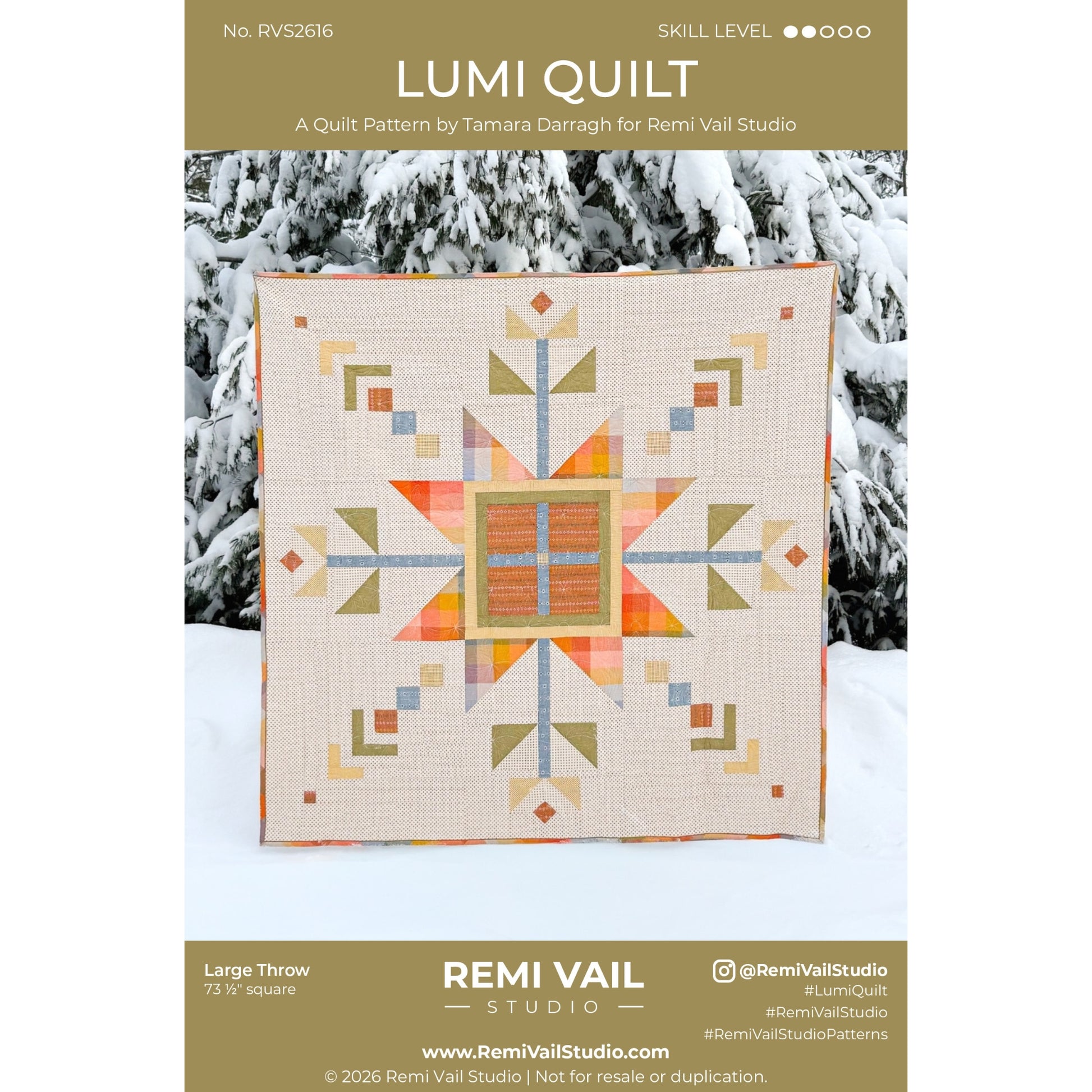 Lumi Quilt pattern by Remi Vail Studio with a geometric quilt design on a snowy background