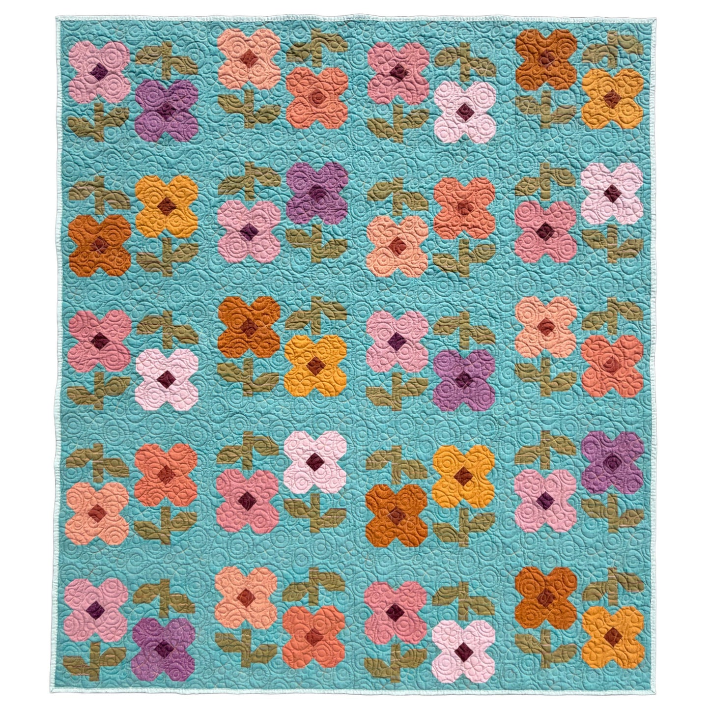 A rectangle Mary Golden Quilt by Remi Vail Studio featuring floral patchwork with four-petal flowers in pink, orange, yellow, purple on a turquoise blue background.