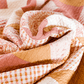 Pink, white, and mustard yellow Love Notes Quilt swirled up.