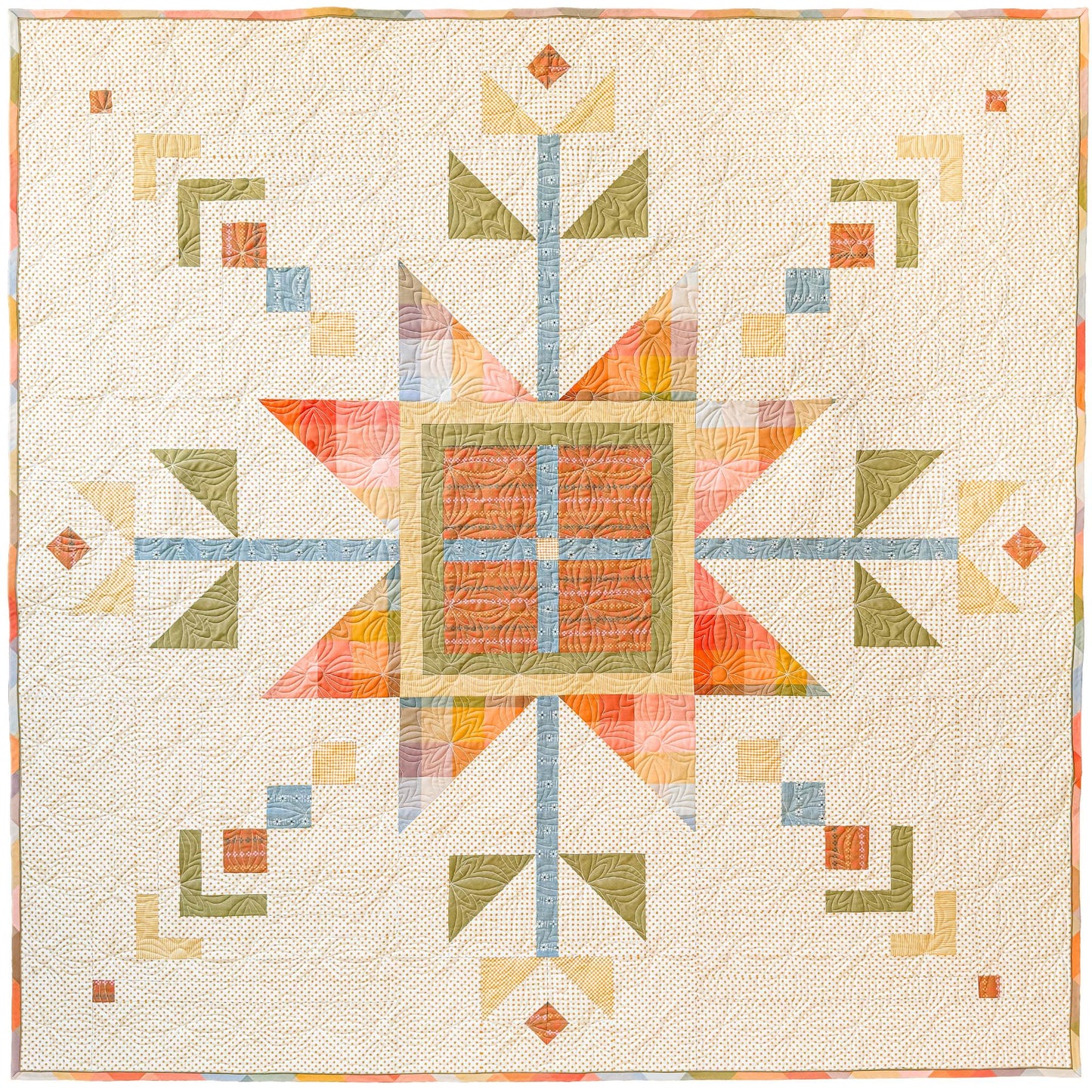 Lumi Quilt with snowflake pattern on a yellow polkadot background