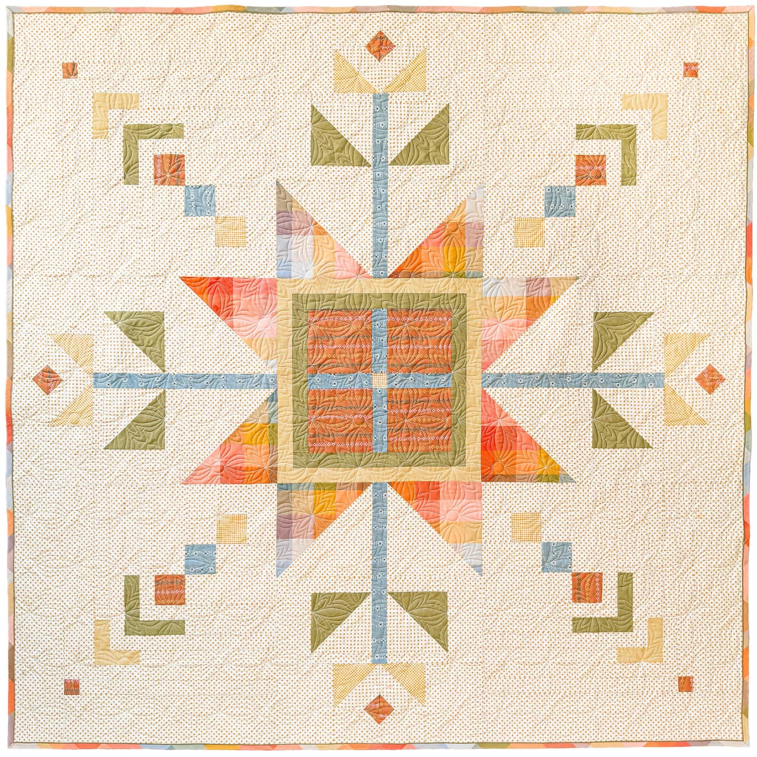 Lumi Quilt with snowflake pattern on a yellow polkadot background