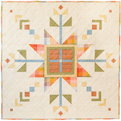 Lumi Quilt with snowflake pattern on a yellow polkadot background