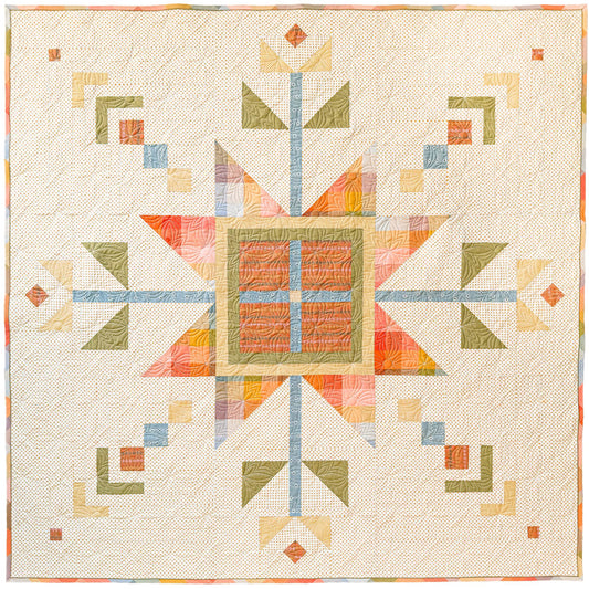 Lumi Quilt with snowflake pattern on a yellow polkadot background
