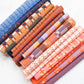 Set of fabric rolls with colorful patterns on a white background